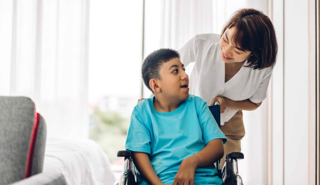 portrait-enjoy-happy-love-family-asian-mother-playing-carer-helping-look-disabled-son-child-sitting-wheelchair-moments-good-time-home-disability-care-concept_11zon